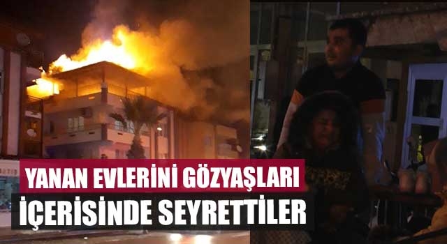 Yanan evlerini gözyaşları içerisinde seyrettiler