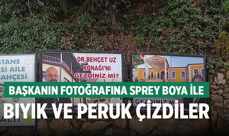Başkanın fotoğrafına sprey boya ile bıyık ve peruk çizdiler